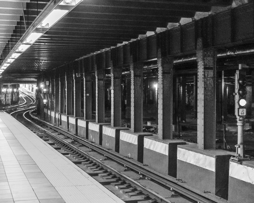 Black and white photo of subway tracks in Midtown Manhattan, NYC. This photo was taken for a class at the International Center of Photography.