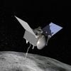 An uncrewed spacecraft with three main components is seen orbiting above an asteroid.