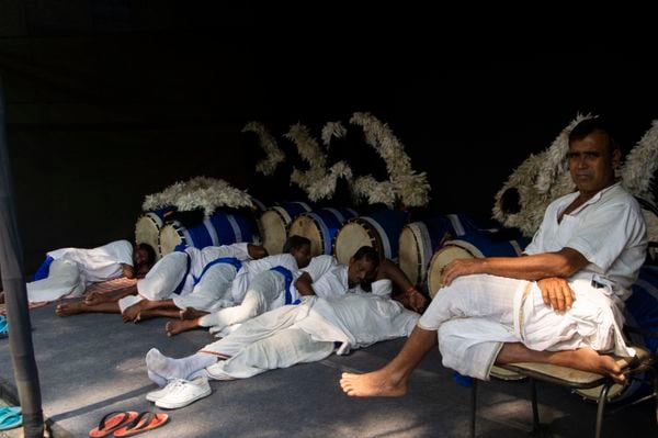 Dhaki wala taking rest during Bengali culture durga puja thumbnail