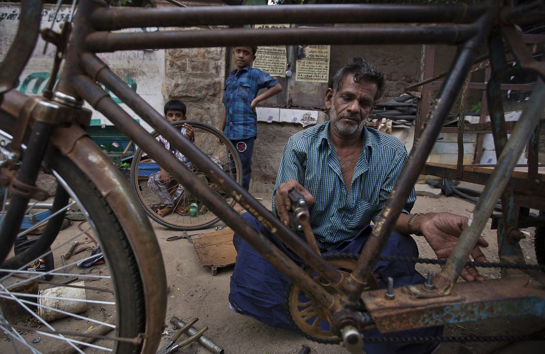 Bicycle repairman in Madurai Smithsonian Photo Contest Smithsonian