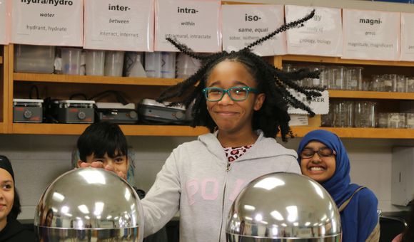 Moments that highlight the joy and excitement of scientific inquiry—such as this student using a Van de Graaff generator—can spark interest in a STEM-related career. Here are some career-focused resources that can supplement that interest. (National Air and Space Museum)