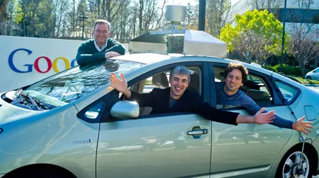 Google founders Eric Schmidt, Sergey Brin and Larry Page in their company's driverless car
