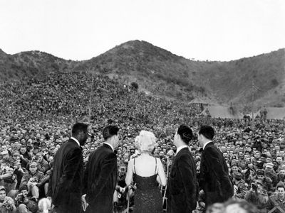 Marilyn Monroe performs in front of service members in Korea in 1954.