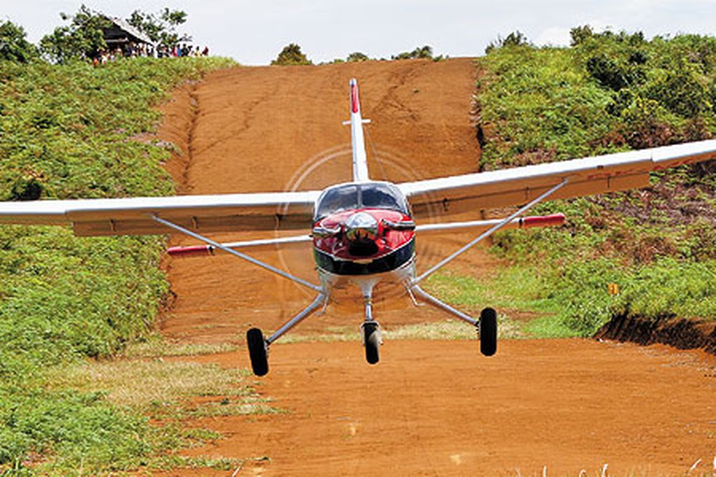Bush flying has unique challenges. This Quest Kodiak gets a little extra thrust on takeoff from the slope of a dirt airstrip carved out of a hill in East Kalimantan, Indonesia.