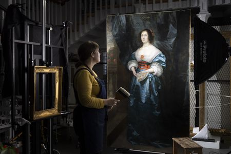 Alice Tate-Harte, a conservator at English Heritage, works on a 17th-century portrait of Diana Cecil.
