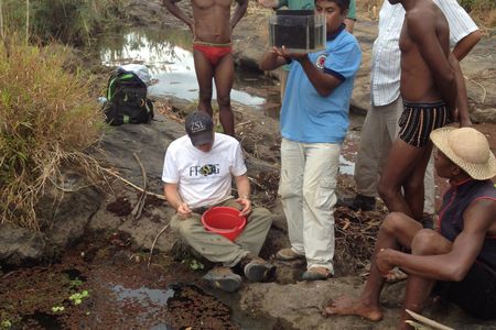 The London Zoo’s Brian Zimmerman looks for a cichlid in Madagascar.