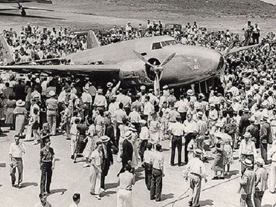 Crowds surround Howard Hughes' Lockheed Model 14-N2 Super Electra, after the aviator's 1938 round-the-world flight.