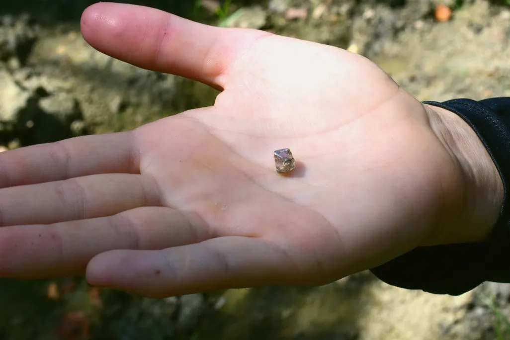 Small gem in a person's open palm