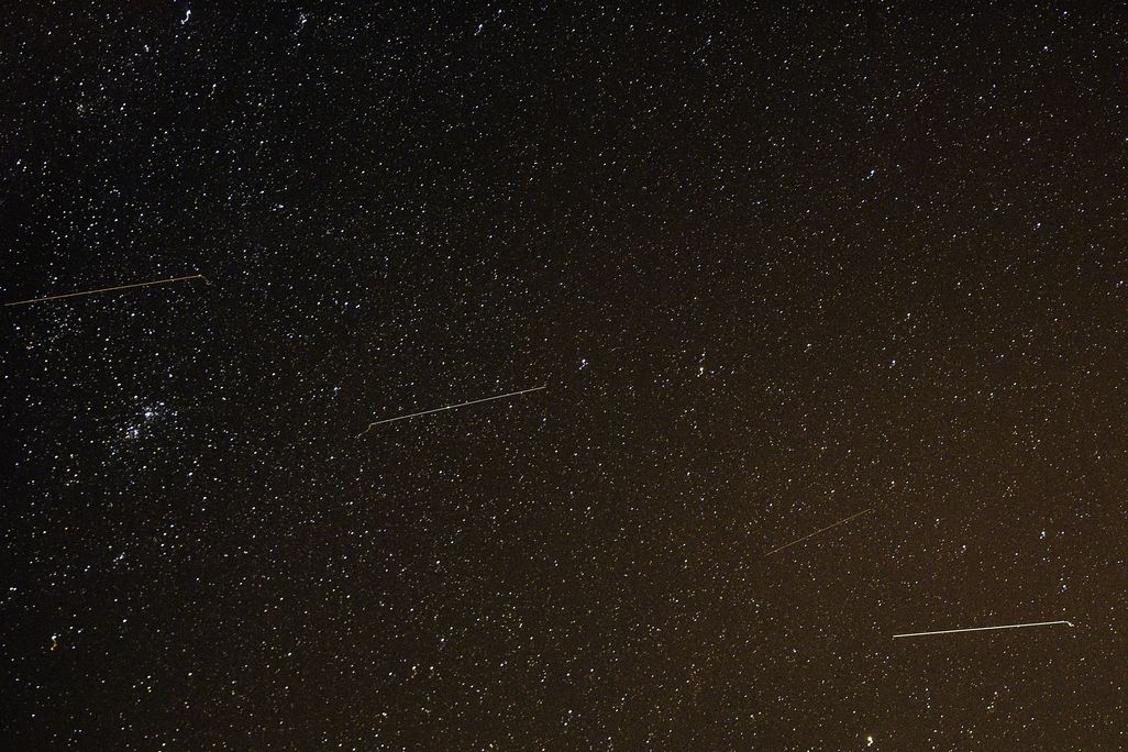 Meteors streak across the night sky during the Orionid meteor shower in Russia in 2016