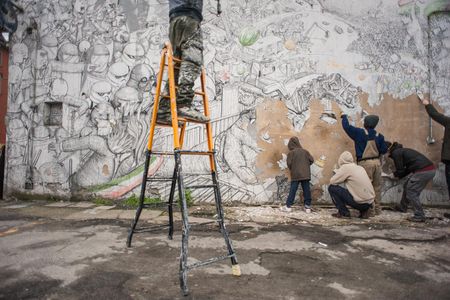 Blu and local activists erased 20 years' worth of his street art from Bologna, Italy. 