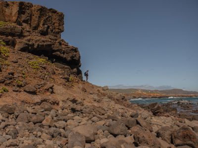 Geochemist Blake Dyer observes the north shore of Molokai.