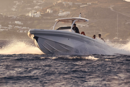 Travelers visiting Mykonos can take in the sights from the water with small groups of family or friends.