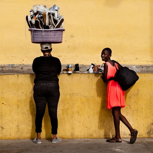 Shoe salewomen on the fishing dock in Takoradi, Ghana thumbnail