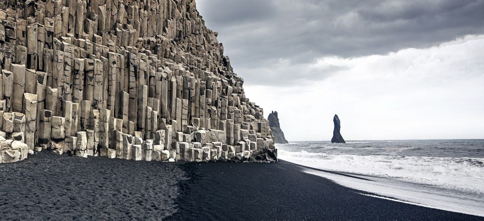  Basalt cliffs and black sand beach at Reynisfjara 