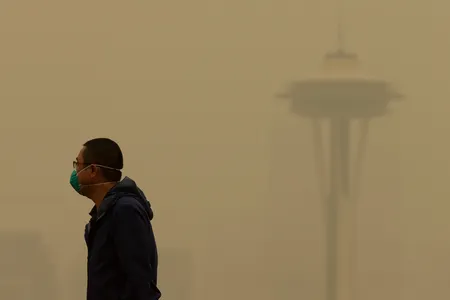 A man in Seattle wears a mask as wildfire smoke descends on the city in September of 2020.