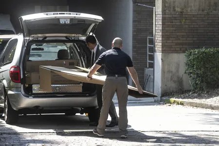 FBI agents loading Basquiat paintings into vehicles at the Orlando Museum of Art