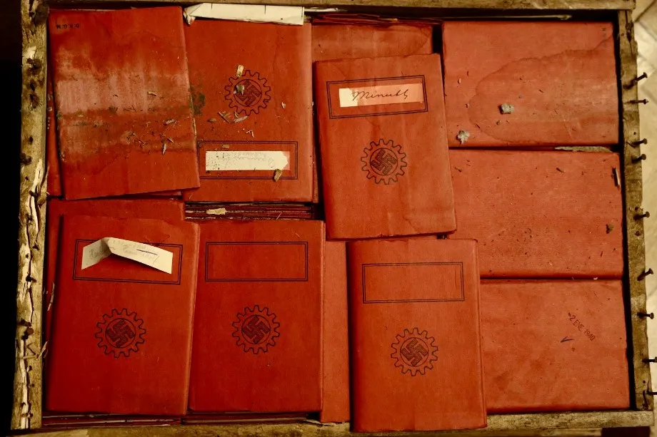 Red notebooks with swastika stamps