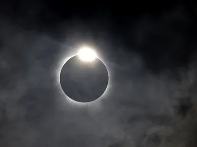 The diamond ring effect is seen as the moon eclipses the sun over Fort Worth on April 8.