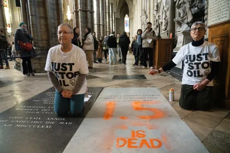 The two Just Stop Oil activists spray-painted &quot;1.5 is dead&quot; on the gravestone of Charles Darwin.