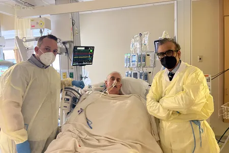 David Bennett with his son and Dr. Muhammad Mohiuddin from the University of Maryland School of Medicine