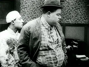 Buster Keaton as a doctor (note his blood-stained smock) and Arbuckle as prospective patient in Good Night, Nurse.