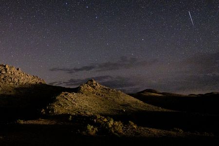 A meteor streaks across the sky near Lone Pine, California, during the annual Perseid meteor shower in 2022.