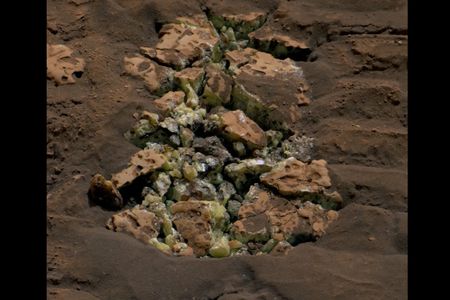 After Curiosity unexpectedly cracked open a Martian rock, it revealed yellow crystals that scientists determined were elemental sulfur.