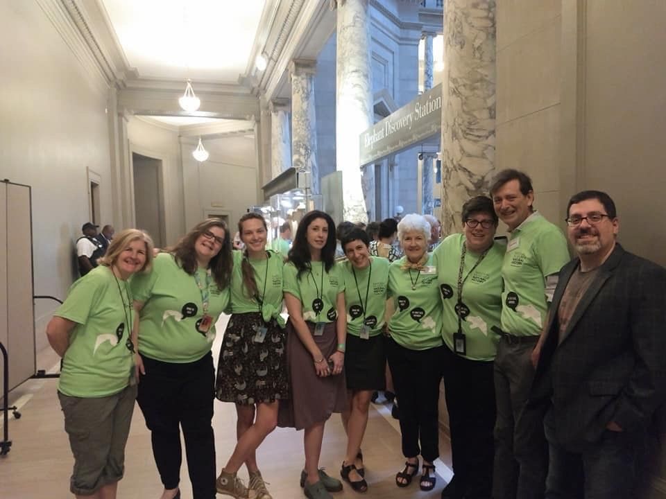 Siobhan Starrs takes a group photo with her "Deep Time" colleagues in the Rotunda on the opening day of the Smithsonian's new "David H. Koch Hall of Fossils - Deep Time"