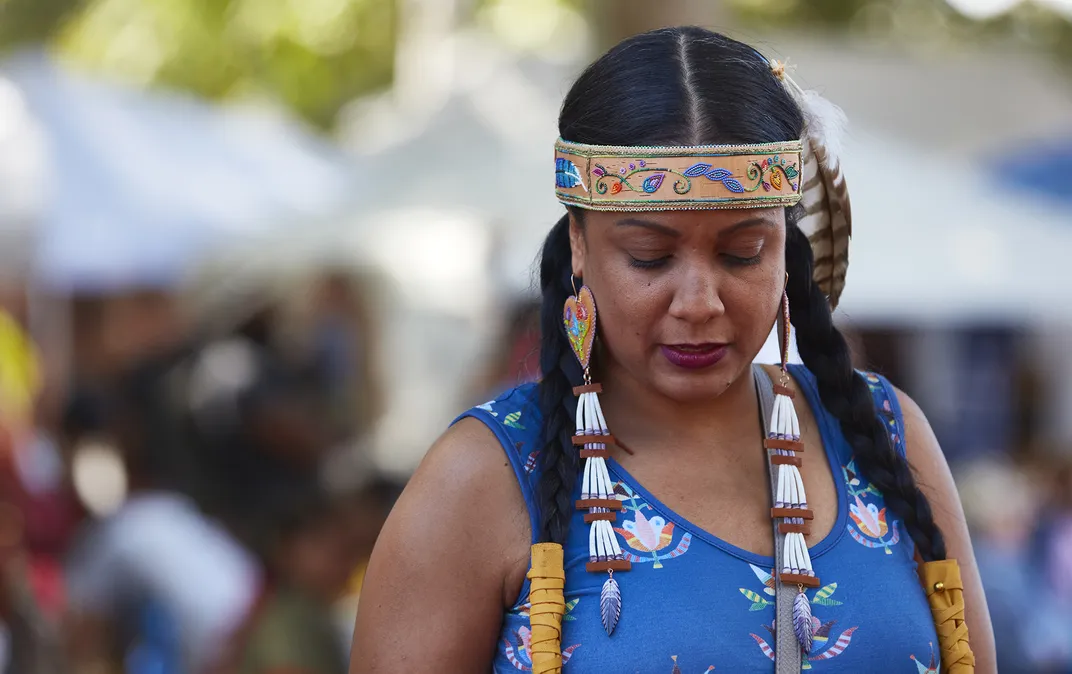 10 - A woman attends an event in New York City to bring awareness to unsolved cases of missing Native American women.