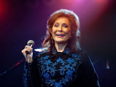 Singer-songwriter Loretta Lynn was applauded—and sometimes banned—for her daring songs about women's lives. 
