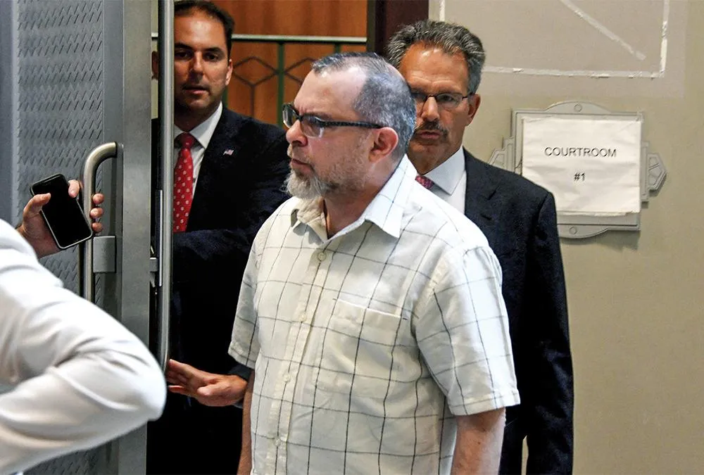 John Schulman leaves after his arraignment