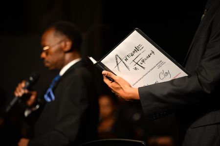 Members of the chorus sing their parts in a performance of  Antigone in Ferguson at Normandy High School in St. Louis.