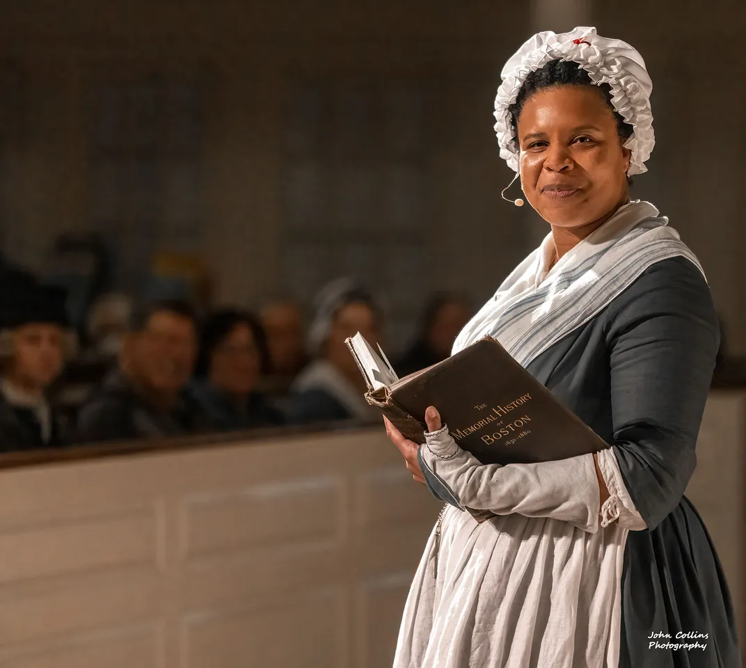 A reenactor portraying Phillis Wheatley at a 2022 event