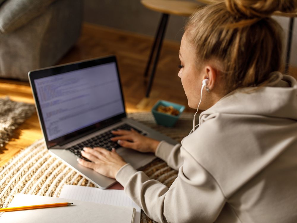 a student works at a laptop