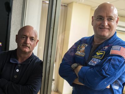 U.S. astronaut Scott Kelly (right) and his twin brother Mark attend a press conference ahead of NASA's "Year in Space" mission at the Baikonur Cosmodrome in Kazakhstan in 2015.