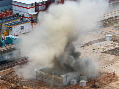 Smoke rises after a World War II-era aerial bomb was detonated at a construction site in Singapore on September 26, 2023.