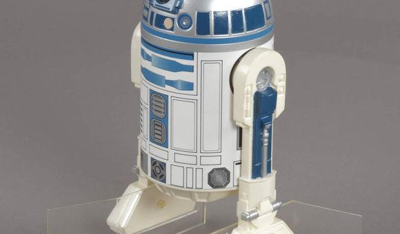An R2-D2 action figure issued for The Empire Strikes Back. Credit: National Air and Space Museum.