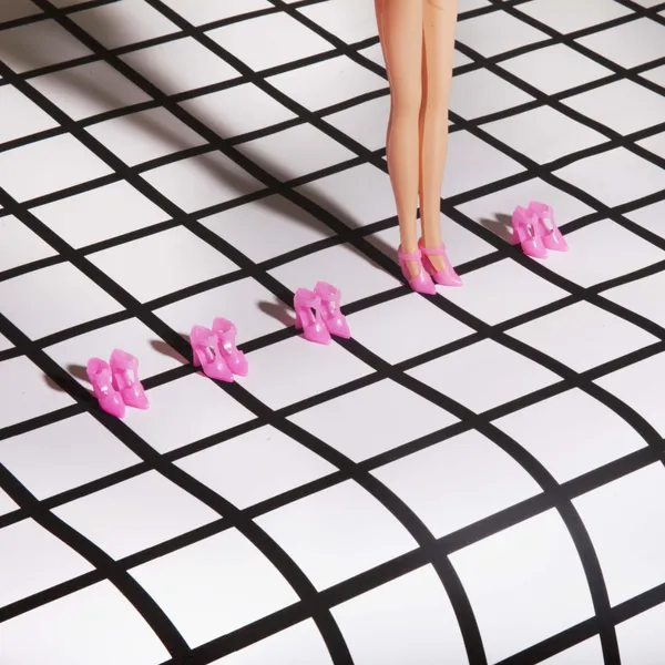 Barbie Stands Before Rows of Pink Shoes on a Warped Grid thumbnail