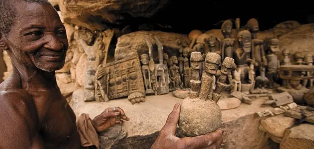 Dogon region villager with ritual figures