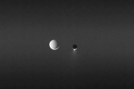 Two of Saturn's satellites, side by side.