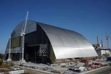 Builders work on the Chernobyl New Safe Confinement arch in April 2016. Once complete, the massive arch will be slid over the reactor's current concrete sarcophagus. 