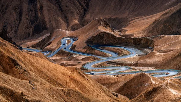 The winding road through mountains thumbnail