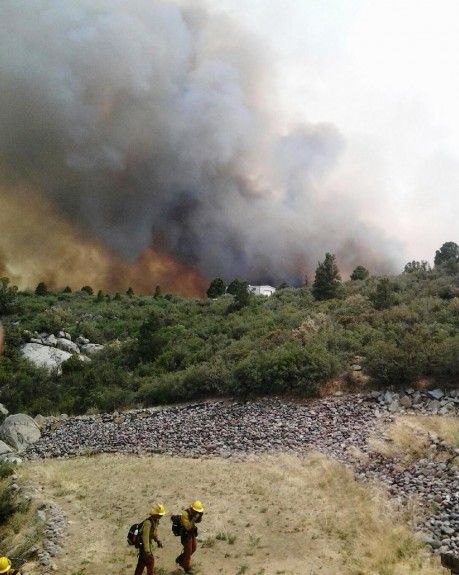 Firefighters stand near the Yarnell Hill Fire in Arizona over the weekend.