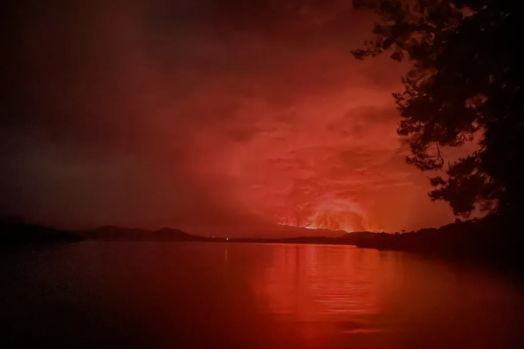 A view of the Nyiragongo volcano erupting taken from Tchegera Island in Lake Kivu.