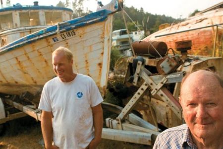 Scrapped fishing boats in Fort Bragg (salvagers Bruce Abernathy and his son David) testify to the sharp decline of chinook salmon.