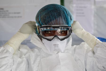A nurse suits up in Liberia before entering an Ebola red zone in 2015. Now, a single case of Ebola has been confirmed in Congo by the World Health Organization. 