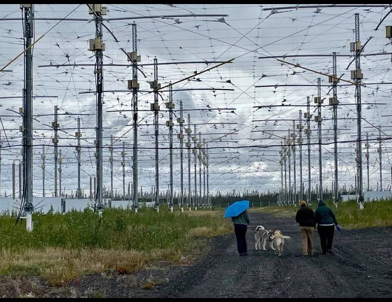 People walking under antennas