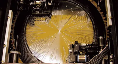 Fred and Ginger quickly and precisely configure the optical fibers beneath them.