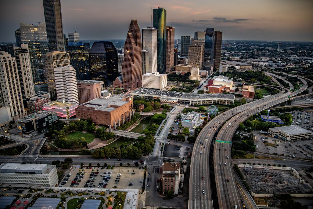an overhead view of the houston city skyline at dusk