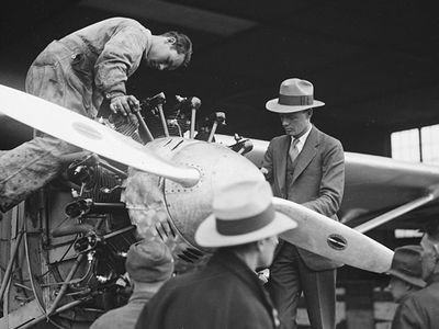 Charles Lindbergh (in fedora) and a mechanic check out the Spirit of St. Louis’ engine circa 1927.